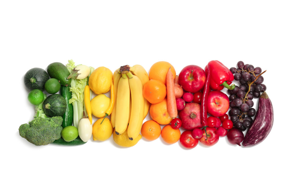 Rainbow composition with fresh vegetables and fruits on white background, flat lay Robyn Puglia